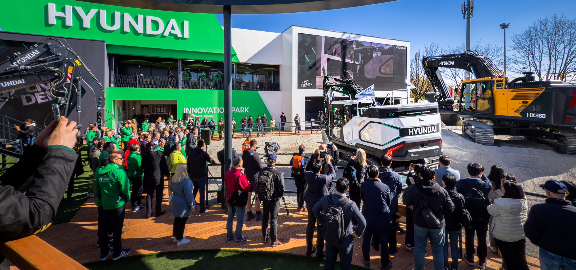 Full view of the HD Hyundai Construction Equipment booth at Bauma 2025